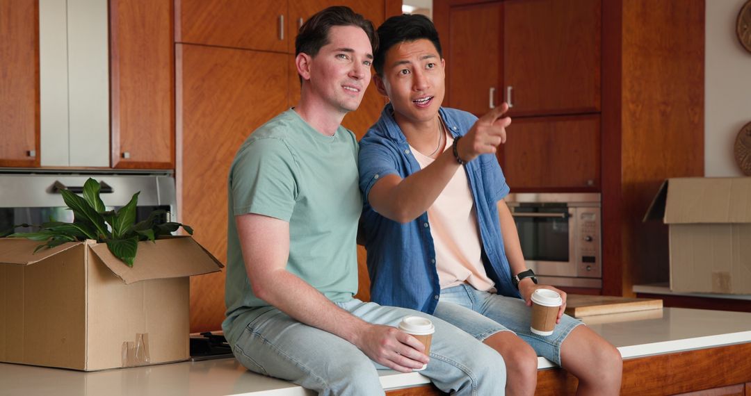 Diverse Gay Couple Enjoying Coffee in Modern Kitchen