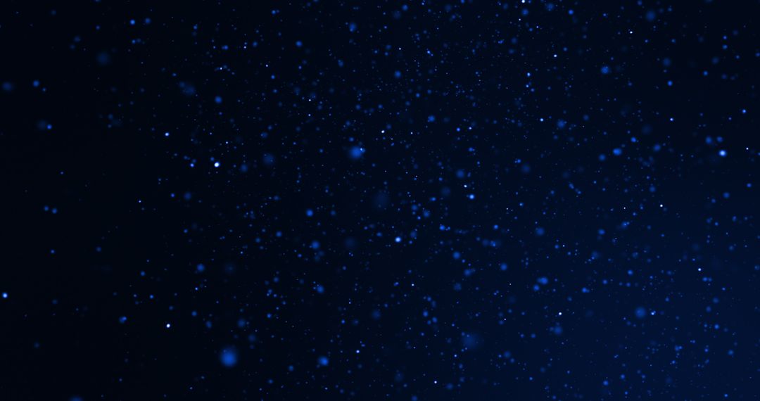 Abstract Blue Particles on Dark Background Capturing Motion