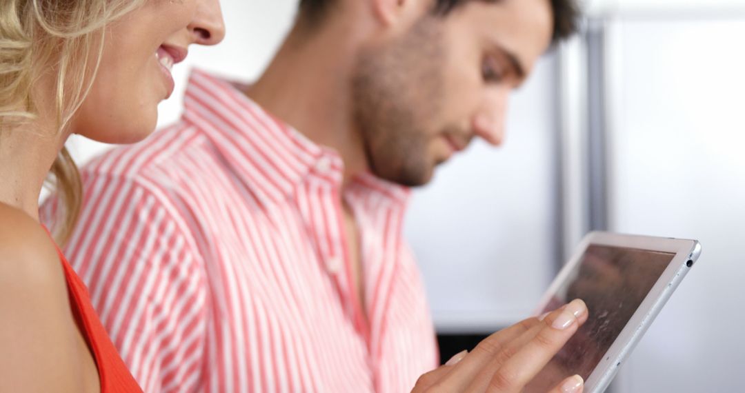 Couple Engaging with Tablet and Smartphone Modern Home