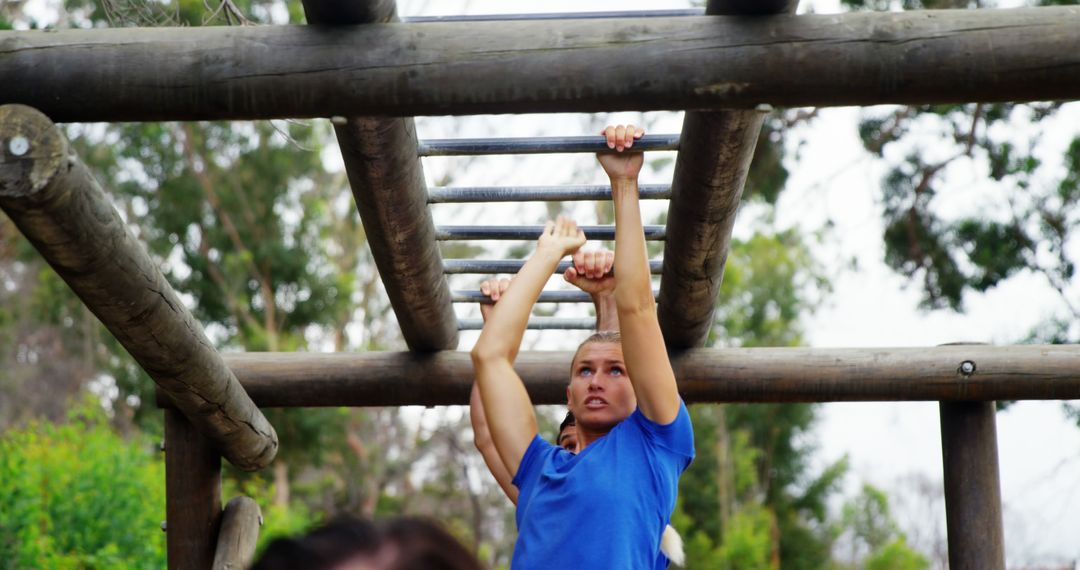 Determined Woman Training on Outdoor Monkey Bars - Free Images, Stock Photos and Pictures on Pikwizard.com