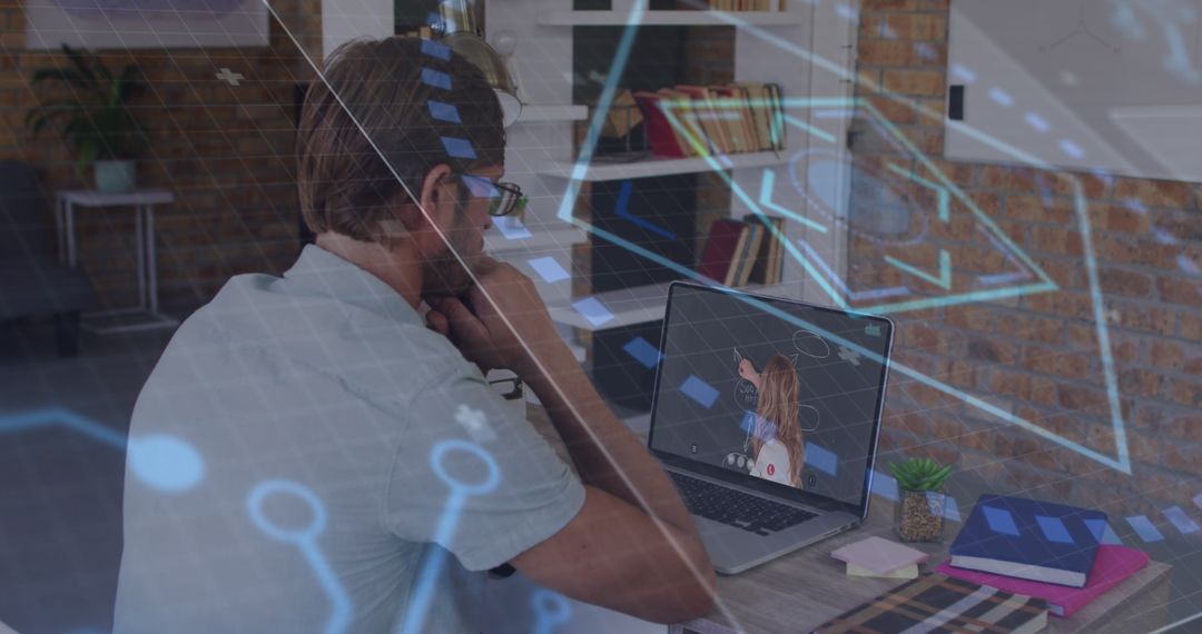 Man Engaged in Virtual Learning with Digital Interface
