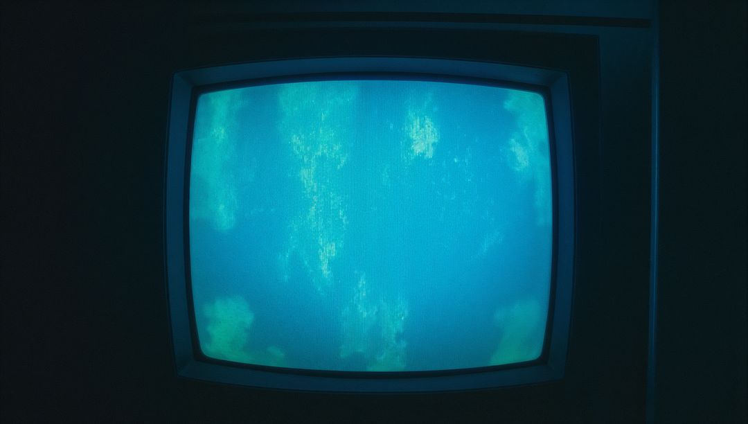 Vintage CRT Monitor Displaying Abstract Blue Patterns