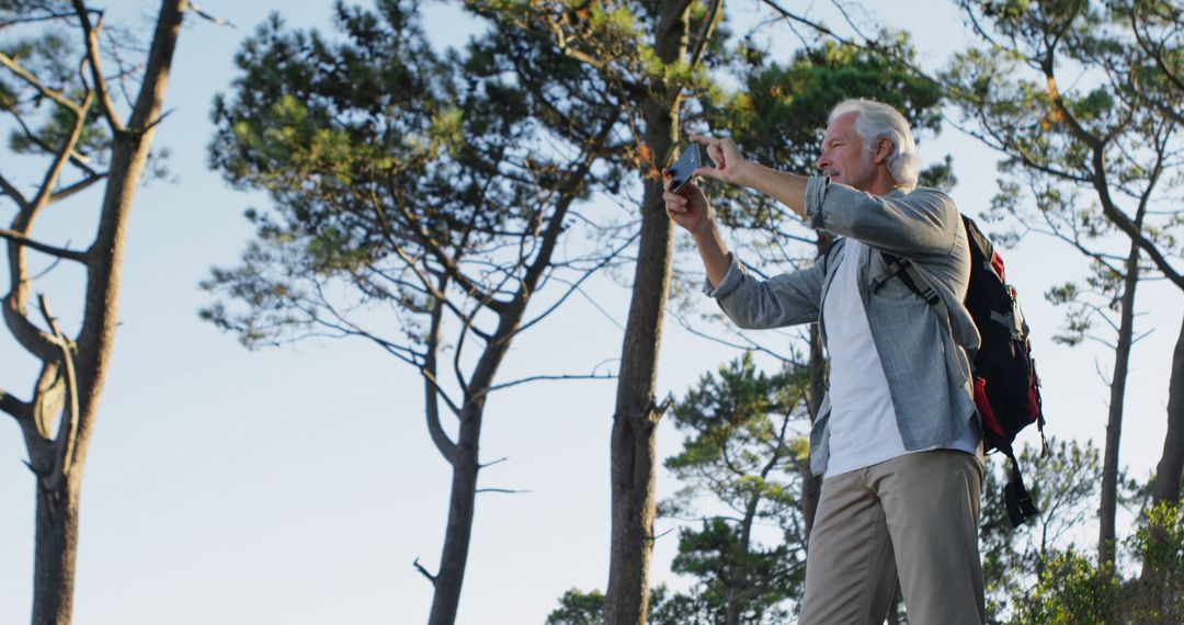 Man Photographing Nature on Outdoor Solo Adventure