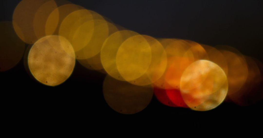 Abstract Golden Bokeh on Dark Background