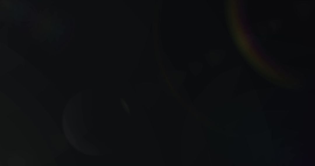 Prismatic Light Beam with Lens Flare on Dark Background