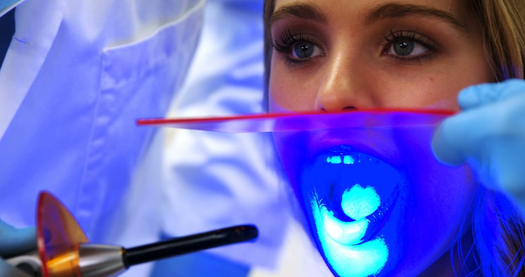 Patient Receiving Laser Teeth Whitening at Dental Clinic - Free Images, Stock Photos and Pictures on Pikwizard.com