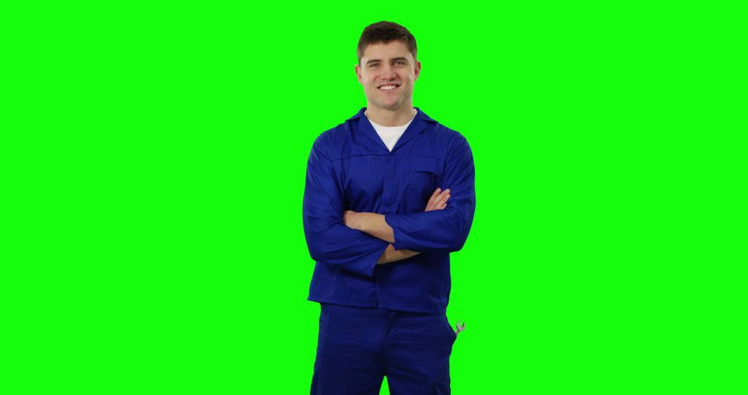 Smiling Worker in Blue Jumpsuit Against Green Screen - Free Images, Stock Photos and Pictures on Pikwizard.com