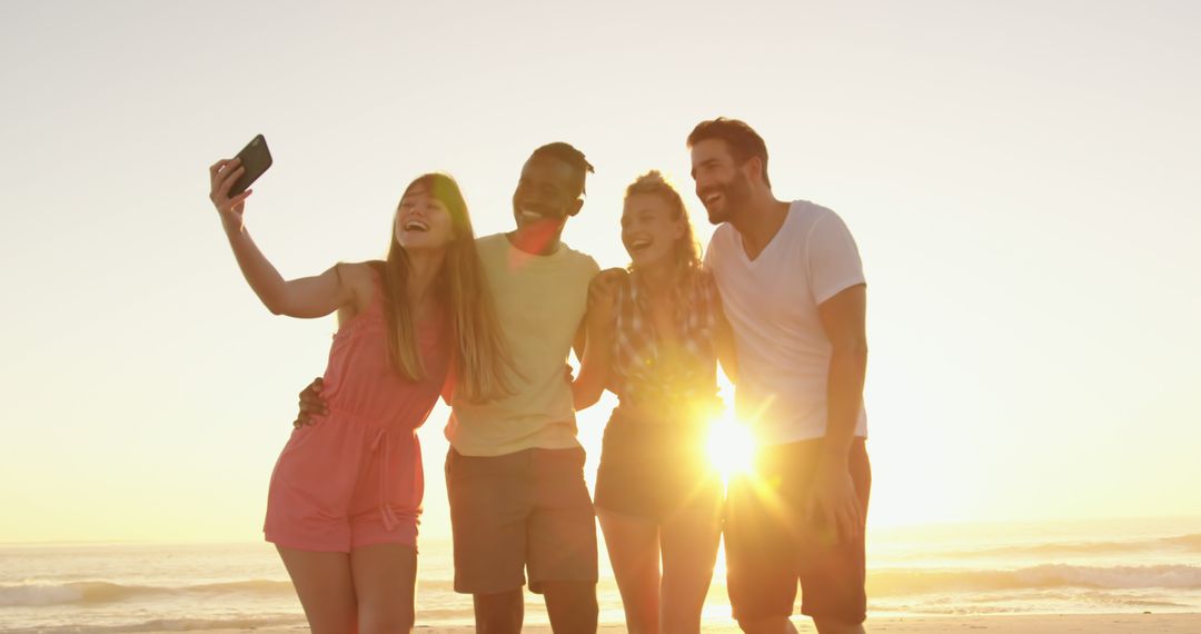 Friends Taking Selfie on Beach During Sunset - Free Images, Stock Photos and Pictures on Pikwizard.com