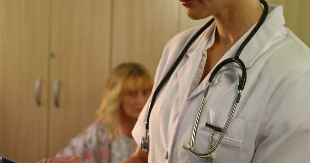 Female Doctor Reviewing Patient Notes with Stethoscope in Office - Free Images, Stock Photos and Pictures on Pikwizard.com