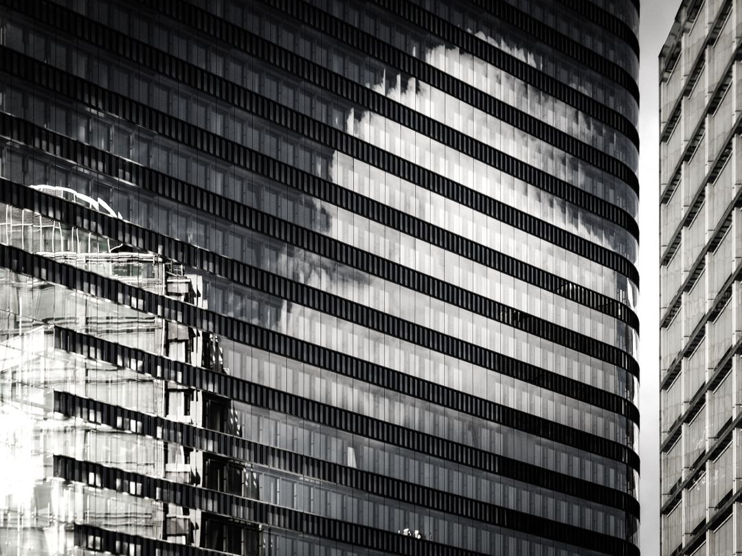 Modern Glass Skyscrapers Reflecting Clouds in Black and White - Free Images, Stock Photos and Pictures on Pikwizard.com