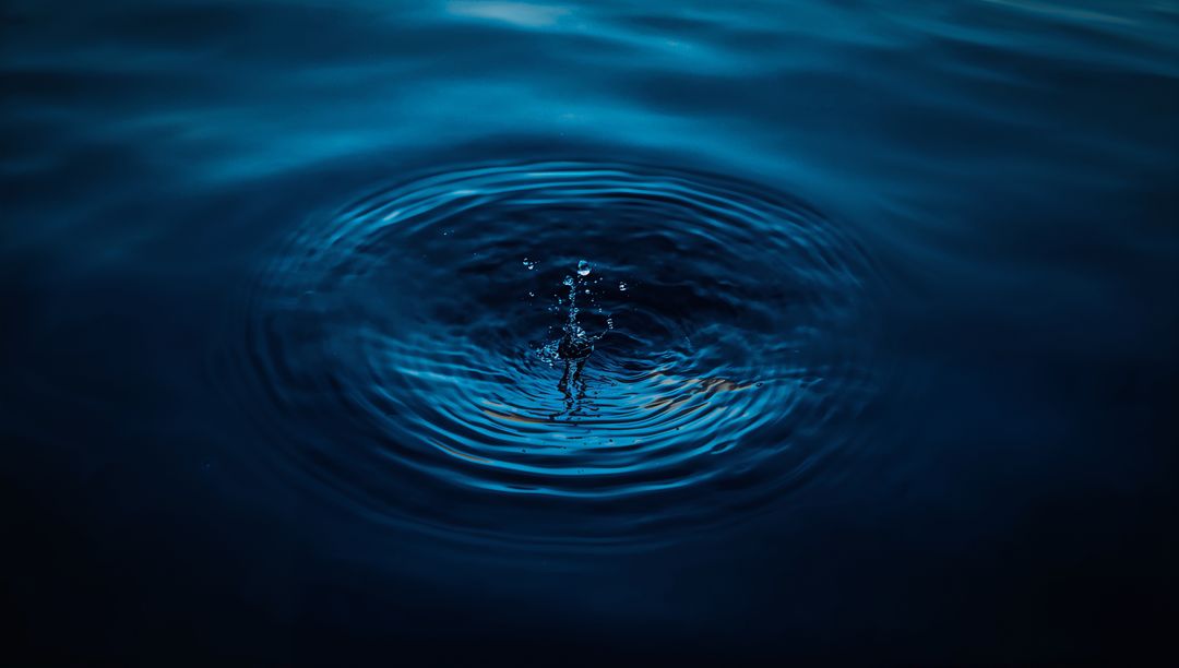 Minimalistic Rippling Water with Droplet Splash in Low Light
