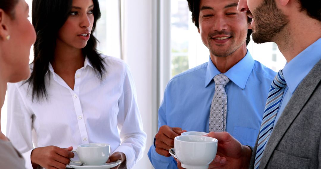 Business Team Engaging in Coffee Break Discussion
