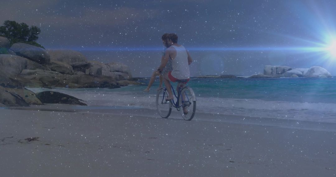 Romantic Couple Cycling on Beach at Twilight