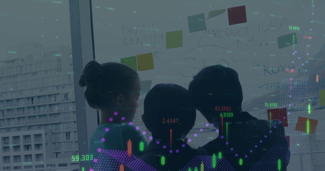 Team Analyzing Financial Data on Glass Wall in Office