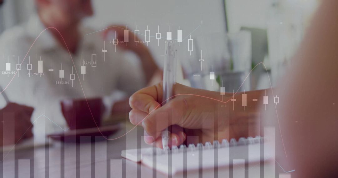 Writing Ideas During Team Meeting with Financial Chart Overlay