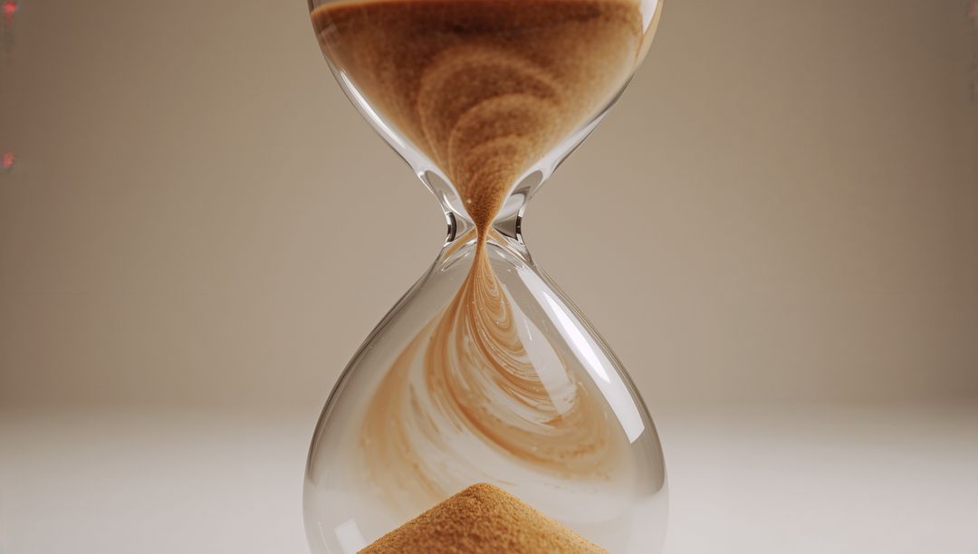 Sand Flowing in Hourglass on Beige Background Symbolizing Time