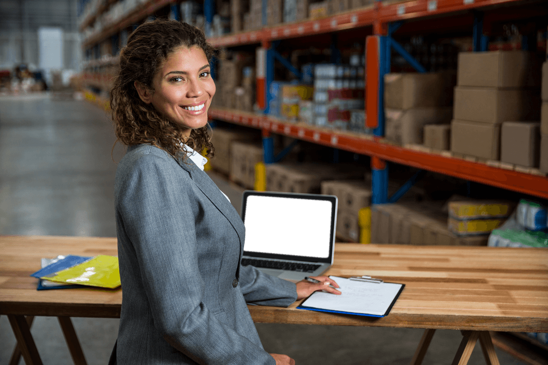 Transparent Clipboard Posing Businesswoman in Warehouse