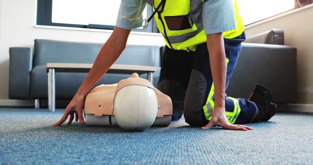 First Responder Practicing CPR on Dummy in Training Room - Free Images, Stock Photos and Pictures on Pikwizard.com