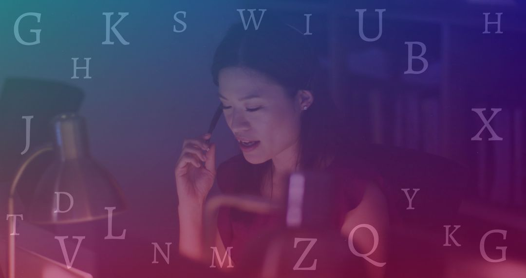 Focused Businesswoman Analyzing Data in Dimly Lit Office