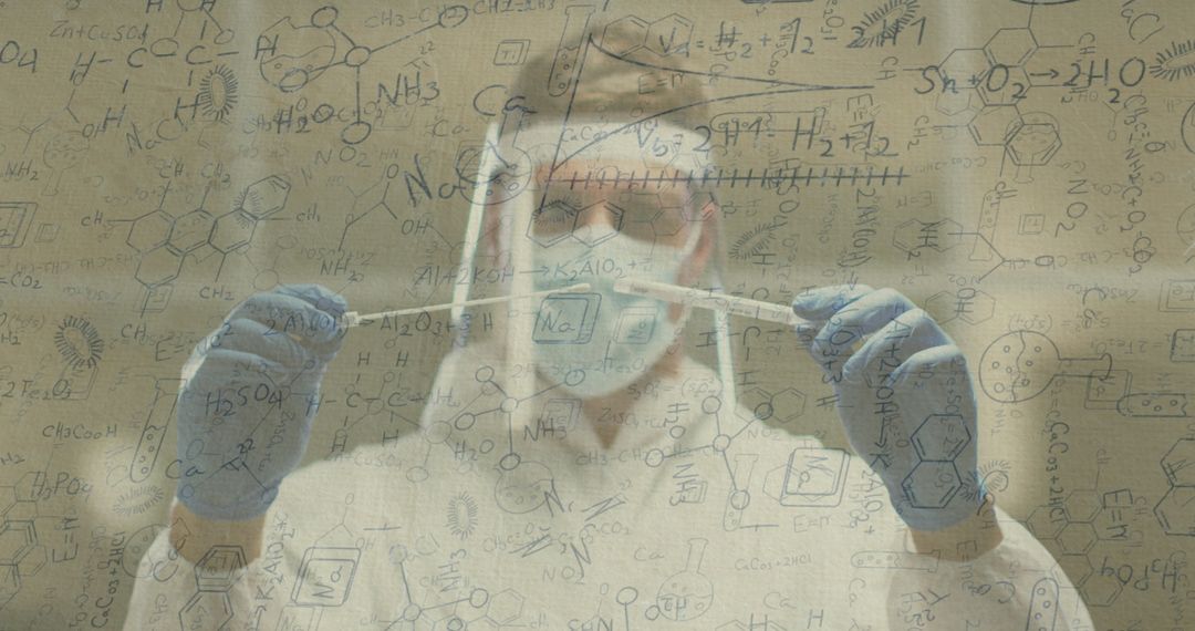 Scientist in PPE Holding Swabs with Scientific Formulas