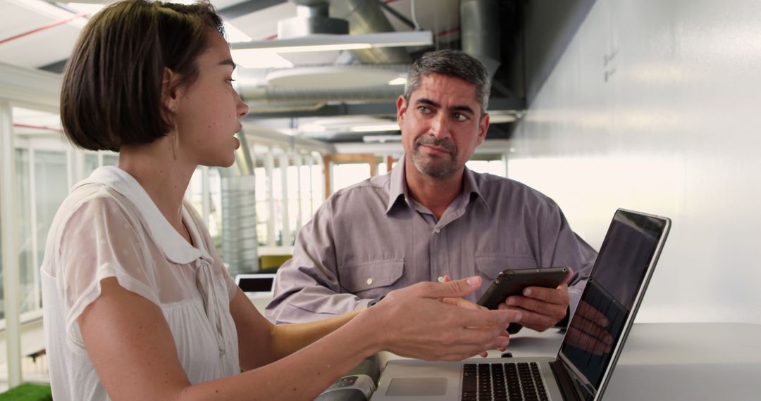 Professional Discussion between Colleagues in Office