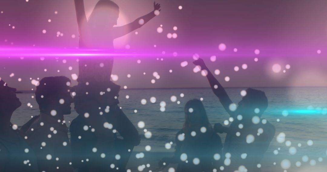 Silhouetted Friends Celebrating by Beach with Bokeh effects