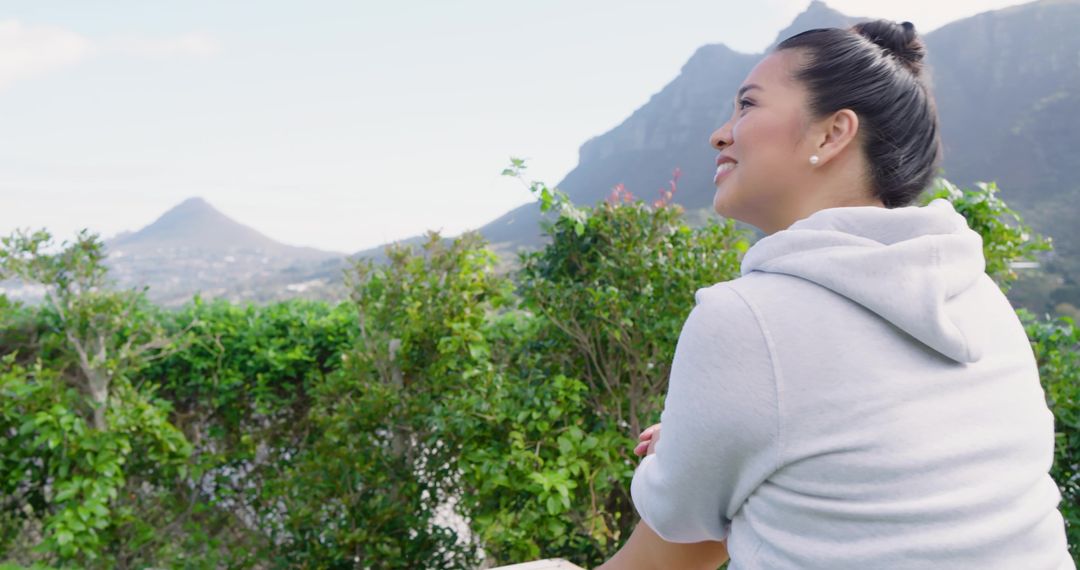 Woman Enjoying Mountain View in Tranquil Nature Setting