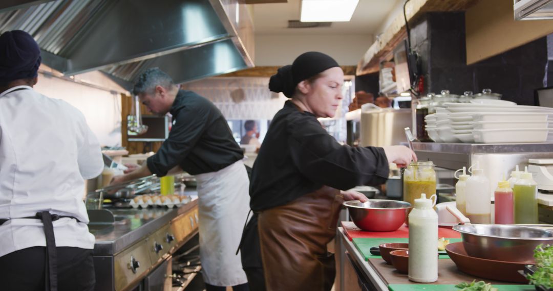 Chefs Collaborating in Busy Professional Kitchen