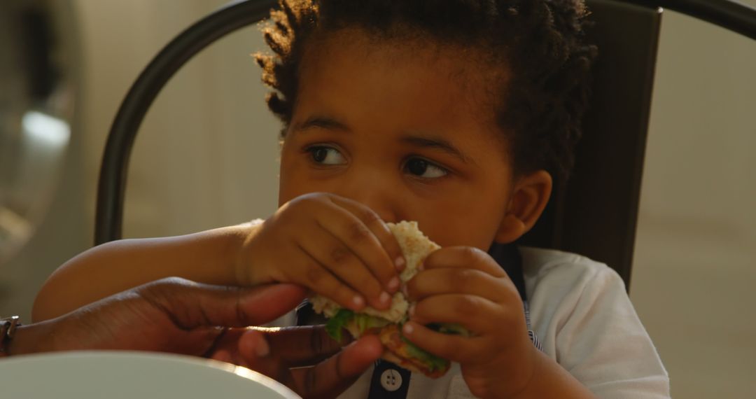 Close-up of Young Child Eating Sandwich - Free Images, Stock Photos and Pictures on Pikwizard.com