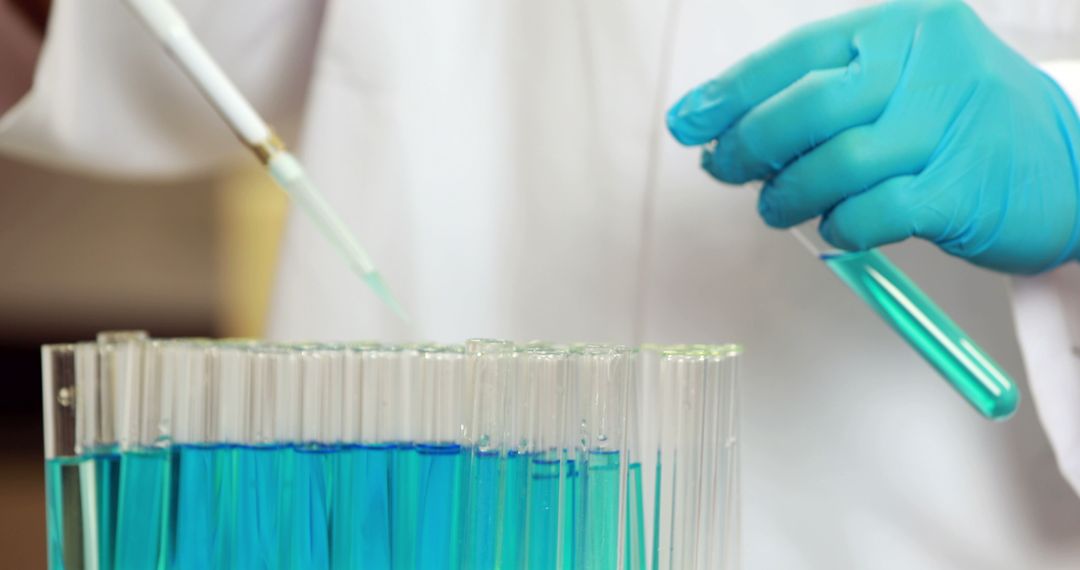 Scientist Analyzing Liquids in Test Tubes in Laboratory - Free Images, Stock Photos and Pictures on Pikwizard.com