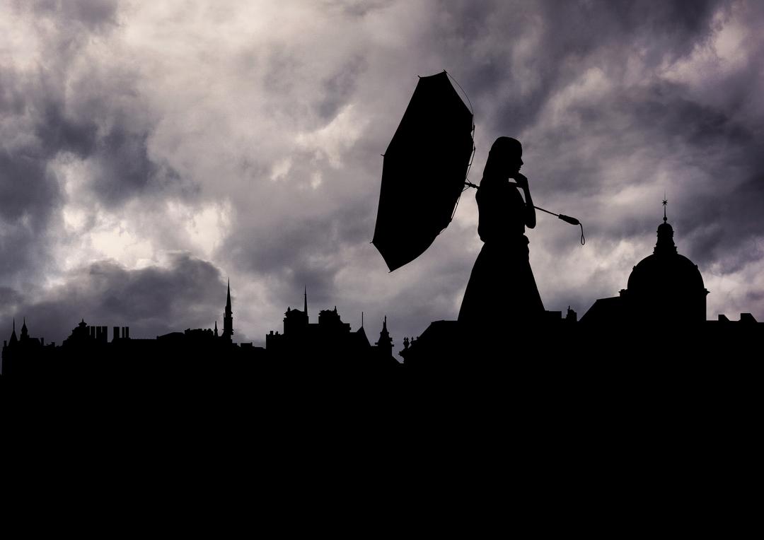 Silhouette of Woman Holding Umbrella Against Stormy Sky - Free Images, Stock Photos and Pictures on Pikwizard.com