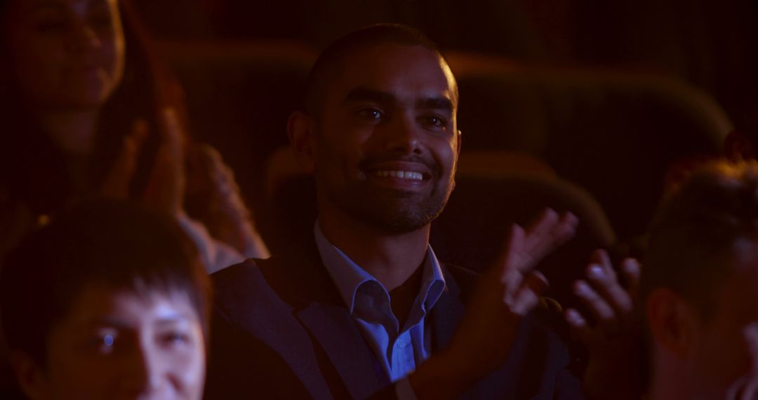 Man Enthusiastically Clapping in Auditorium - Free Images, Stock Photos and Pictures on Pikwizard.com