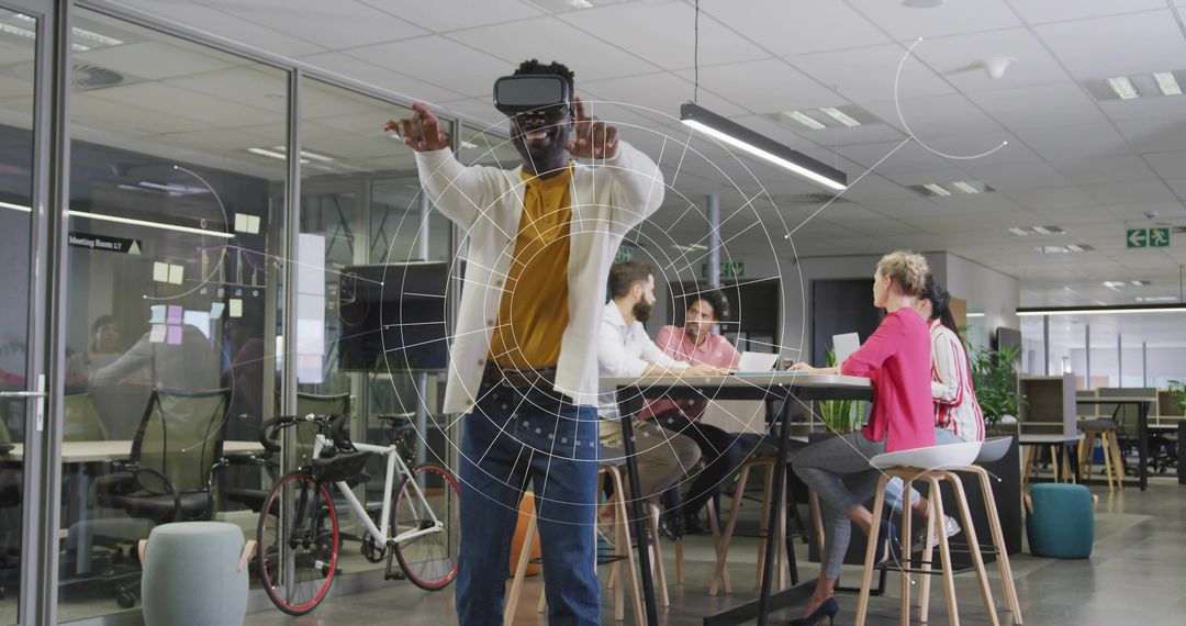 Man Wearing Virtual Reality Headset Gesturing Through AR Interface in Modern Office Hub