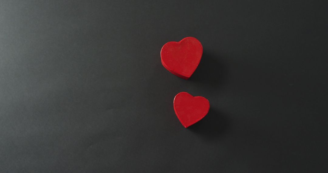 Red Heart-Shaped Boxes on Dark Background for Valentine's Day