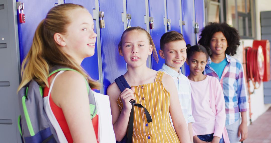 Diverse Group of Students Standing in Front of Blue Lockers - Free Images, Stock Photos and Pictures on Pikwizard.com