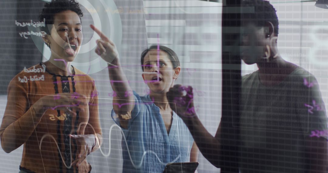 Diverse Colleagues Analyzing Digital Data in Modern Office