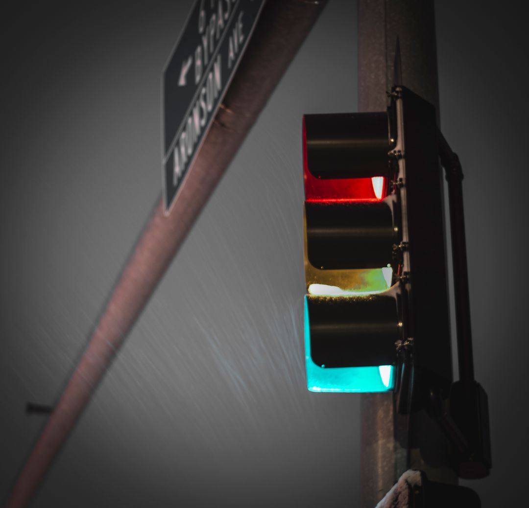 Traffic Light During Snowfall at Night Intersection - Free Images, Stock Photos and Pictures on Pikwizard.com