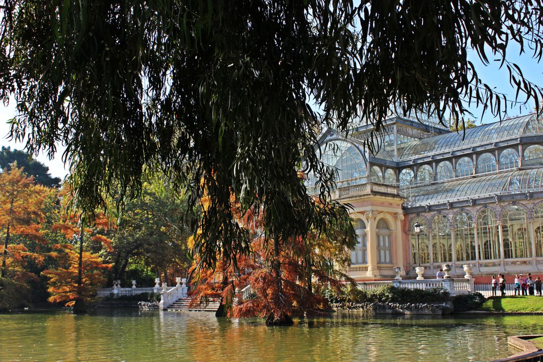 Crystal Palace by Tranquil Lake in Autumnal Park - Free Images, Stock Photos and Pictures on Pikwizard.com