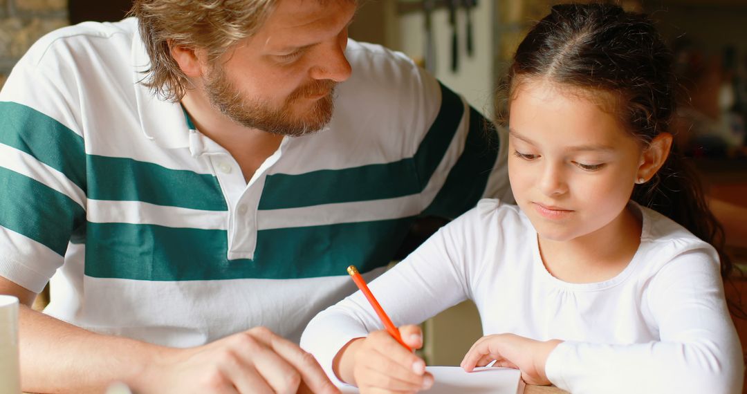 Father Help Daughter with Homework at Kitchen Table - Free Images, Stock Photos and Pictures on Pikwizard.com