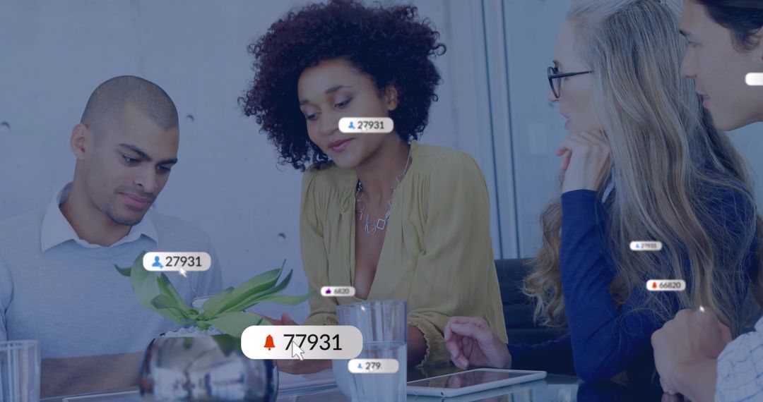 Diverse team collaborating around tablet with leader guiding social engagement metrics