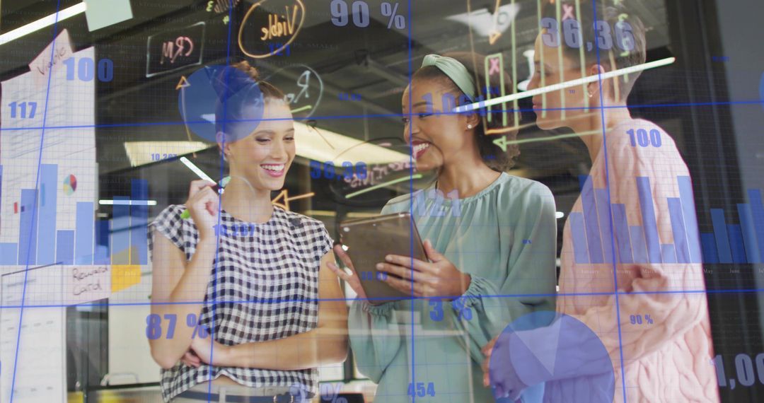 Businesswomen Analyzing Data with Modern Digital Tools in Office