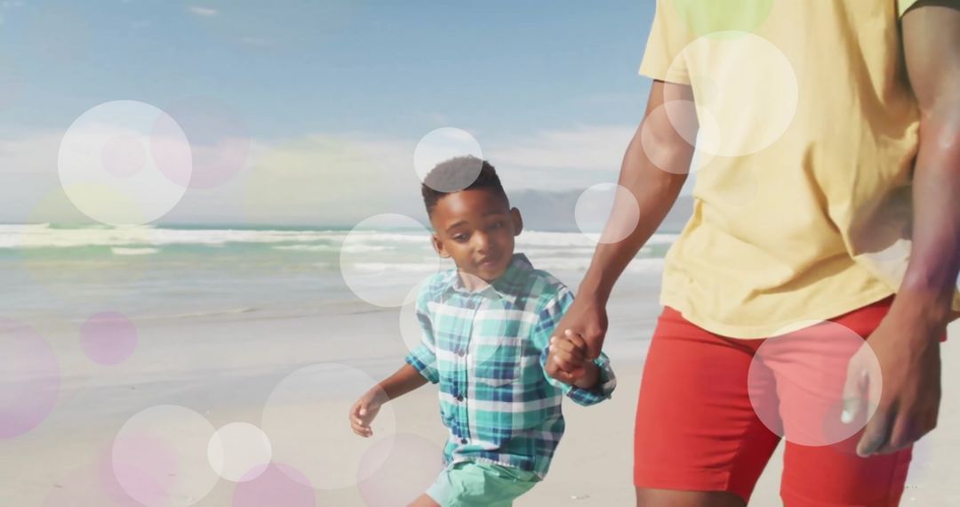 Joyful African American Father and Child on Sunny Beach Walk