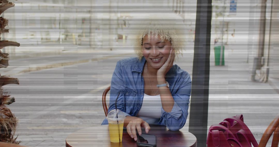 Woman Enjoying Leisure Time at Sidewalk Cafe