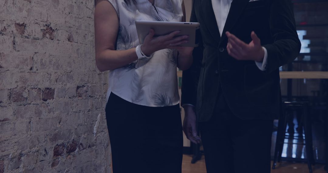 Business Professionals Collaborating with Digital Tablet