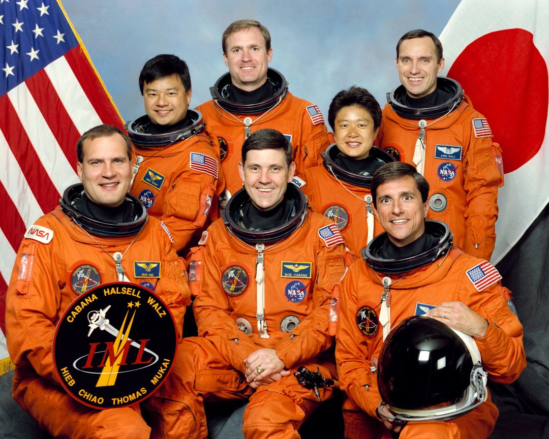 NASA Astronauts and Japanese Payload Specialist in Space Suits with Flags, 1994