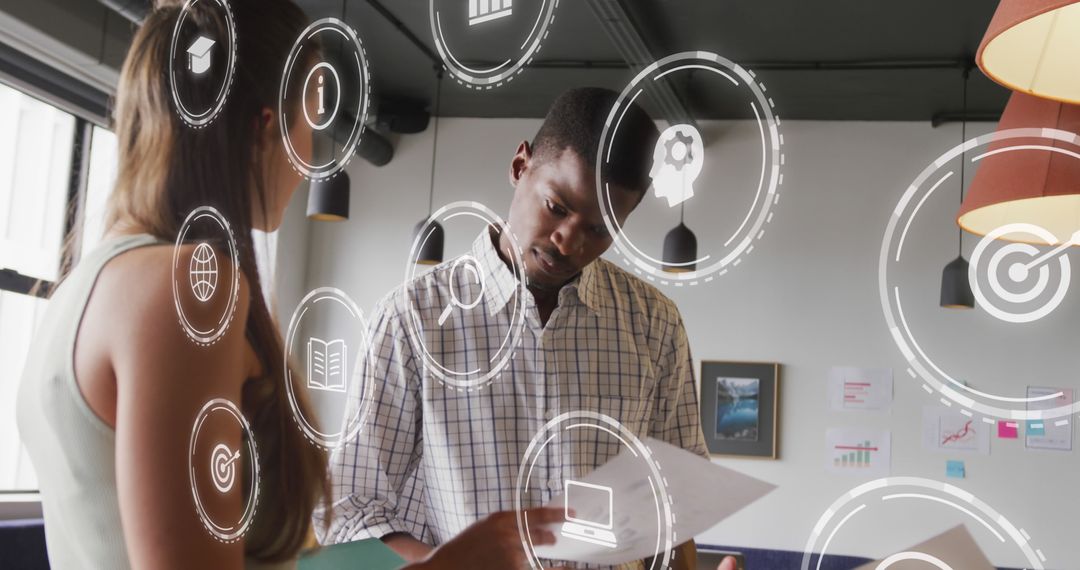 Diverse Colleagues Analyzing Documents with Futuristic Digital Interface Icons