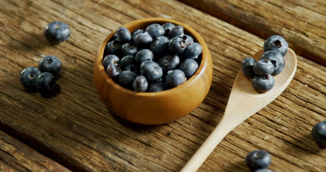 Fresh Blueberries in Wooden Bowl on Rustic Wooden Table - Free Images, Stock Photos and Pictures on Pikwizard.com