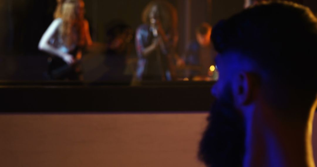 Audio Engineer Thumbs Up to Band in Recording Studio