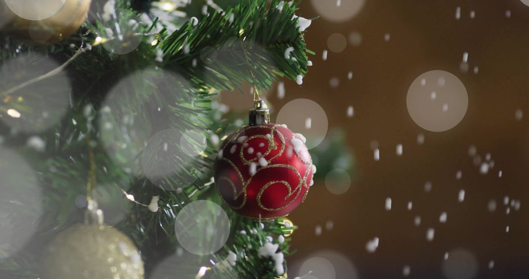 Christmas Tree With Red Ornament and Falling Snow