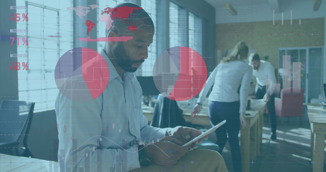 Man Using Tablet in Open Office with Data Analytics Overlay and Team Collaboration